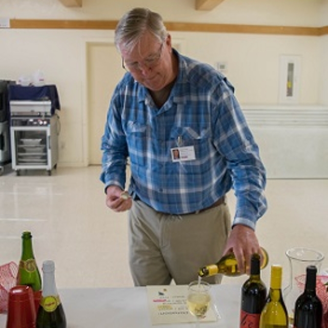 Tom Fischer,pouring,wine