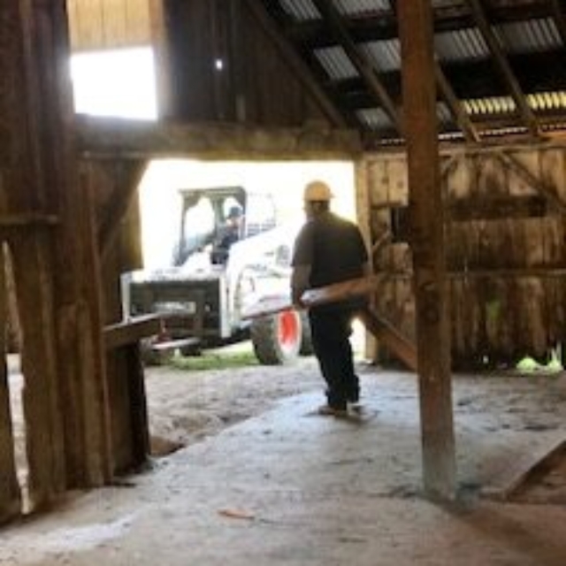 tractor,worker,barn,wood