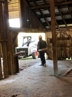 tractor,worker,barn,wood