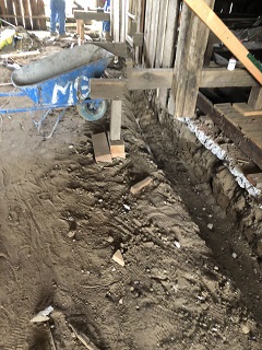 wheelbarrow,construction,trench,foundation,dirt