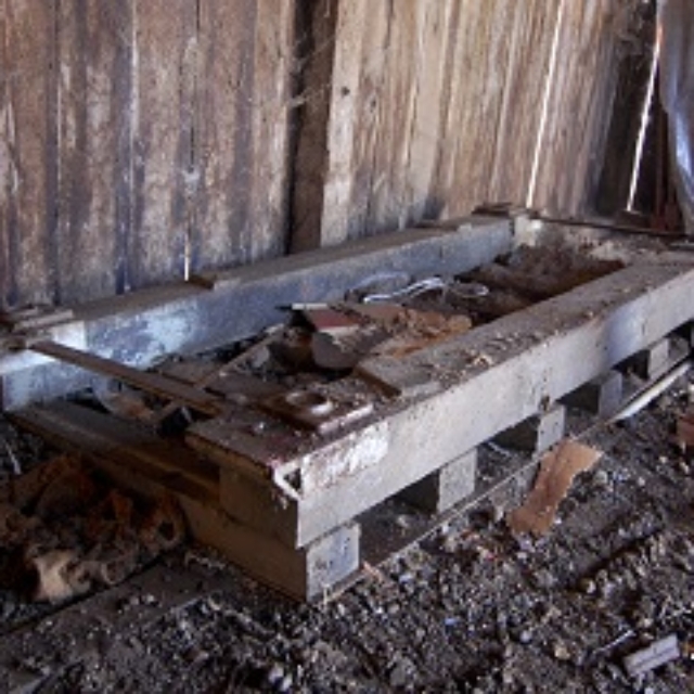 barn,wood,cinder block,metal,dirt
