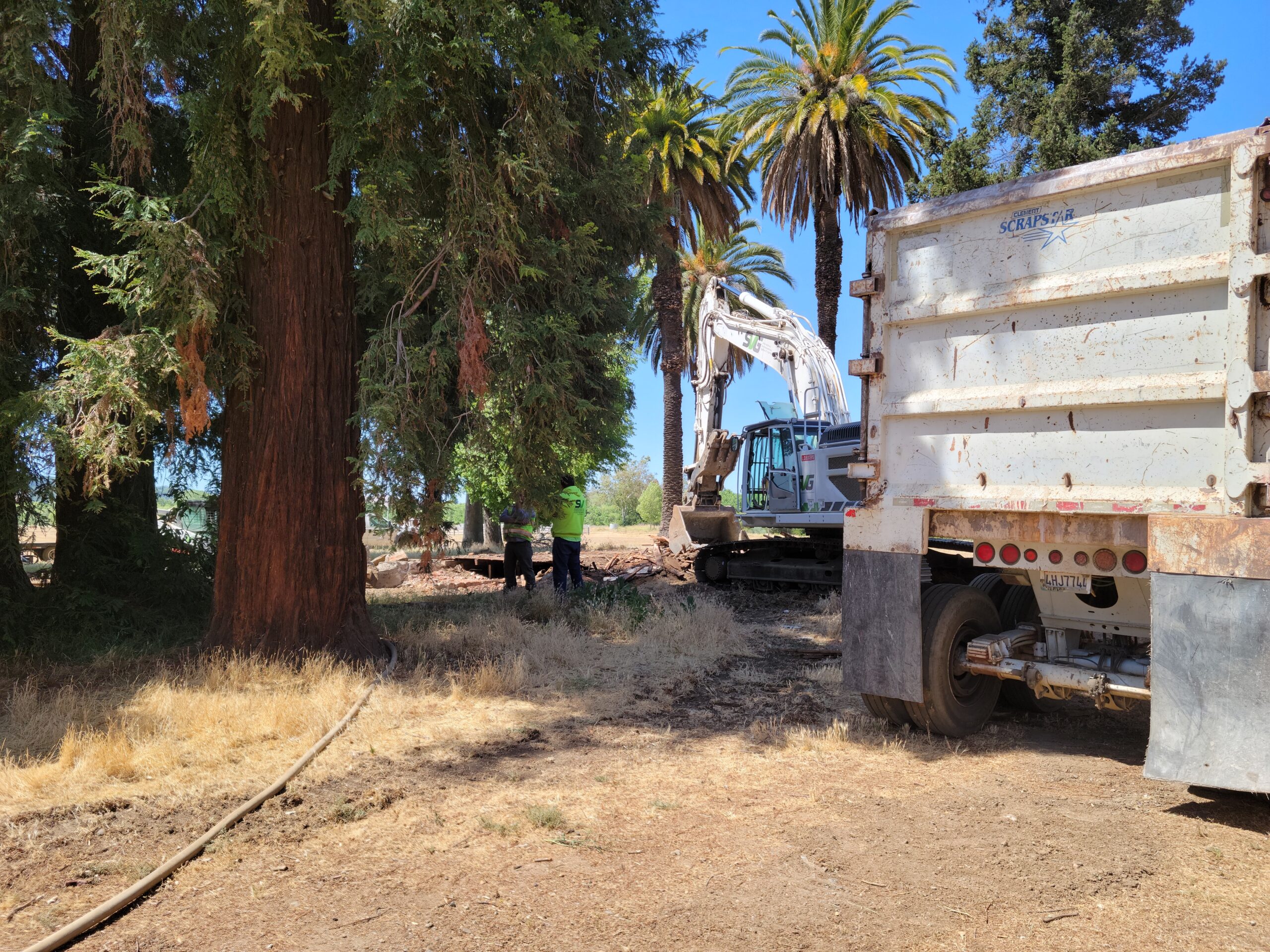 trailer,trees,excavator